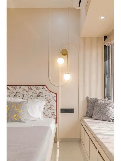 This shot highlights the cozy window seat, providing a comfortable spot for relaxation, and the simple, elegant lines of the wall paneling.