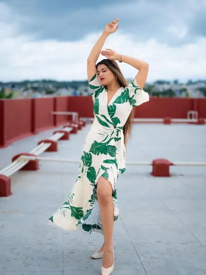 A duplicate of image 105, this full-length portrait on a rooftop with the city skyline in the background is dynamic and fashionable.