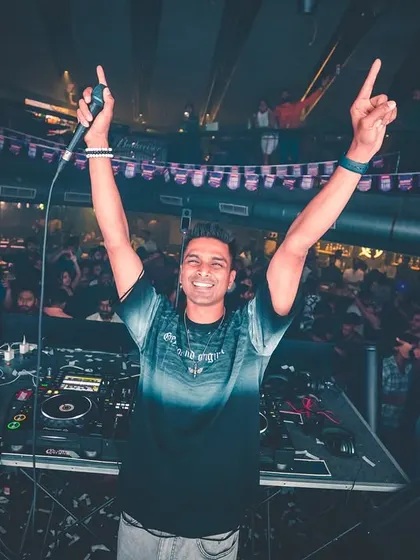 The connection with the crowd is everything. This shot from a packed night at FLO captures that moment of shared joy, with hands in the air and a smile that says we're all in this together.