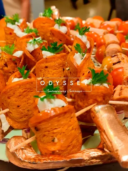 These rolled appetizers are filled with a creamy mixture and garnished with fresh herbs. They are an elegant and flavorful option for any sophisticated gathering.