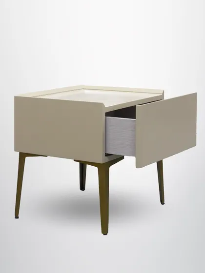 The side table's drawer provides convenient storage, making it as functional as it is stylish.