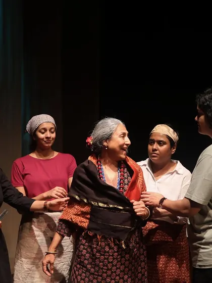 The cast of "The House of Bernarda Alba" in a candid rehearsal moment, showcasing the collaborative spirit of our all-women ensemble.