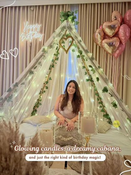 Midnight surprises just hit different. This dreamy cabana setup, complete with fairy lights, a "Happy Birthday" neon sign, and heart-shaped balloons, is perfect for a cozy and romantic birthday morning.