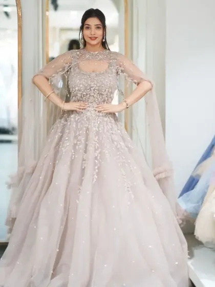 A full shot of the actual pastel gown from the "Wedding Edition" box. The delicate beadwork and ethereal cape make it a dream outfit for an engagement or reception.