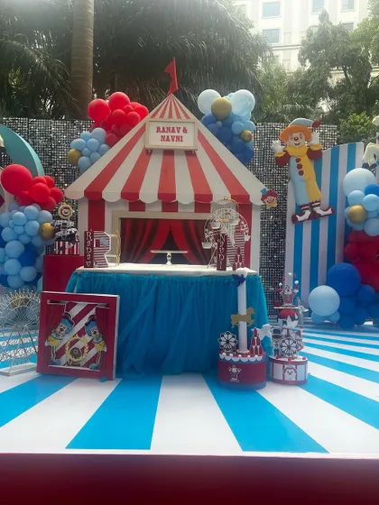 The carnival stage is ready for action. The ticket booth, complete with a red and white striped awning, served as the perfect focal point for this fun-filled birthday party.