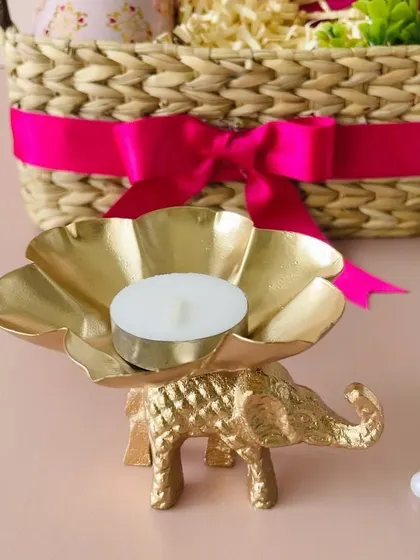 This golden elephant t-light holder is a beautiful and auspicious decor piece that adds a touch of Indian royalty to our gift sets.