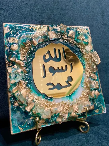 Another view of the emerald green Mohr e Nabuwat piece, showing its vibrant colors.