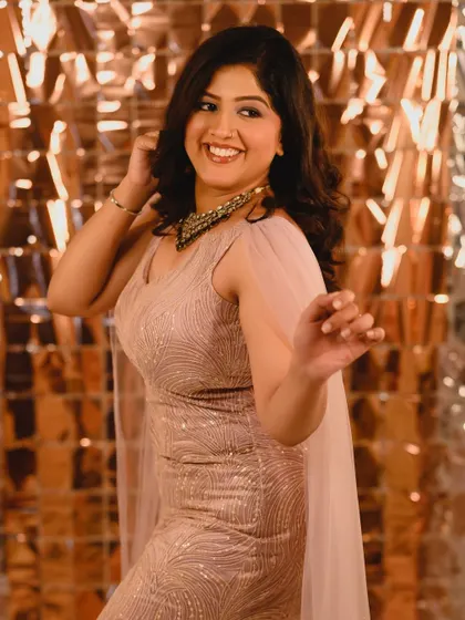 A playful and happy moment captured on camera. The makeup is designed to be long-lasting and photo-ready for hours of celebration.