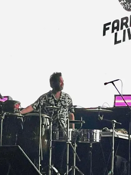 On my percussion rig during a Farhan Live show. You can see my electronic pads and timbales, which allow me to blend modern and traditional sounds.