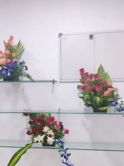 These flower arrangements are perfect for placing on shelves, tables, or as part of a larger stage setup.
