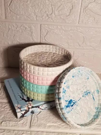 A stack of our round marshmallow trays, showing the different colors we offer.