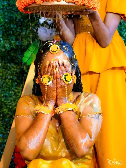 A candid moment of the bride during her Haldi ceremony, a beautiful and colorful pre-wedding ritual.