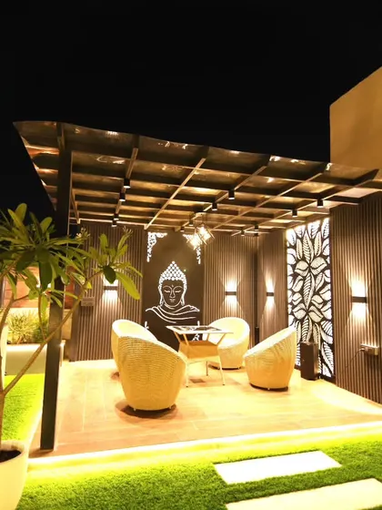 A full view of the pergola structure in our Sushant Lok project, showing how it creates a defined and cozy outdoor room.