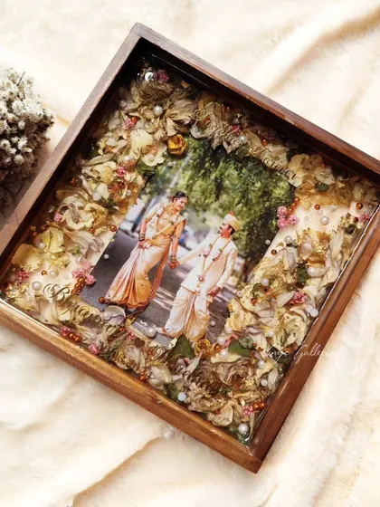 The finished "Garden of Love" frame, with preserved lotus and rose petals creating a stunning floral border.