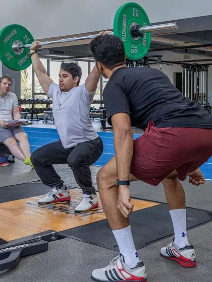 An overhead squat assessment during our UKSCA course, a fundamental movement screen to evaluate mobility and stability.