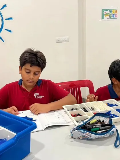 Students from Vidyashilp Academy focused on their workbooks during our LEGO Education after-school program. We emphasize understanding the theory behind the build.