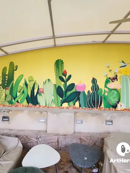 A cheerful and colorful cactus garden mural. This piece uses a bright yellow background and a variety of cacti and flowers to create a warm, desert-inspired vibe.
