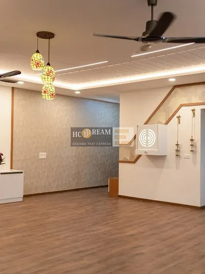 Another view of the Prestige Shantiniketan living room, highlighting the staircase and the open, airy feel created by the light color scheme and thoughtful layout.