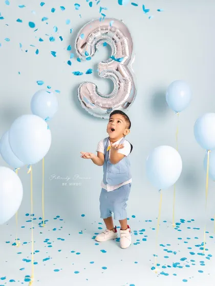 The pure, uncontainable joy of a three-year-old. This confetti shot perfectly captures the energy and excitement of a birthday.
