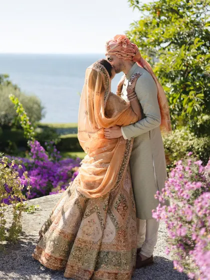 A romantic kiss overlooking the stunning Italian coastline. This is the kind of epic, breathtaking shot that destination weddings are made for.