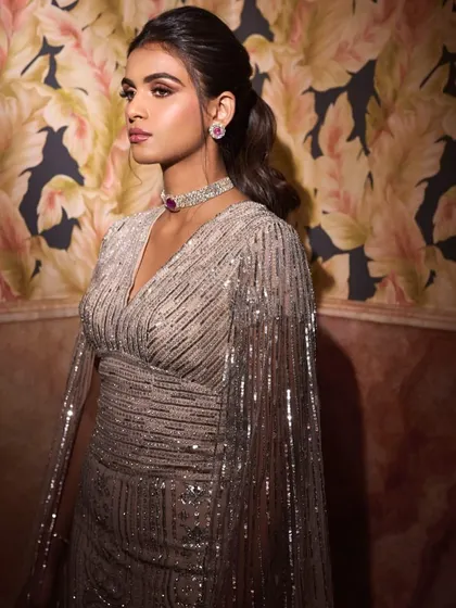 A close-up of Manisha's engagement look. The ruby and diamond choker adds a pop of color to the monochromatic silver gown.
