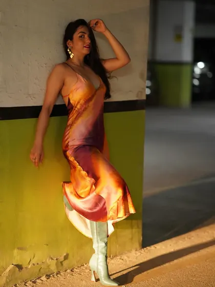 If you're waiting for me to care, you better bring a chair. A sassy and confident pose in the tie-dye dress and statement boots.