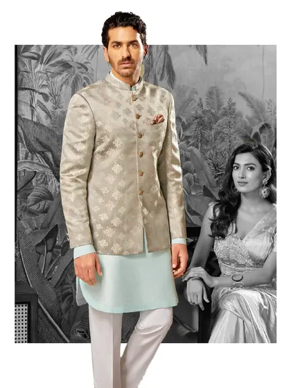 Timeless elegance, redefined. This look pairs a textured beige bandhgala with a light blue kurta, creating a layered festive look that exudes regal charm.