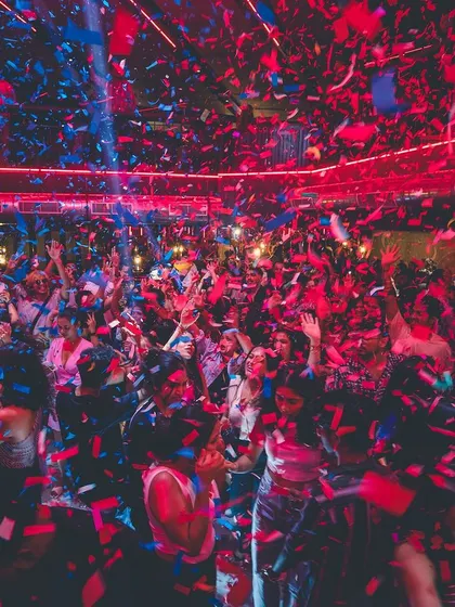 A blizzard of red and blue confetti covers the entire dance floor. This is the kind of explosive finale I love to create for big events.