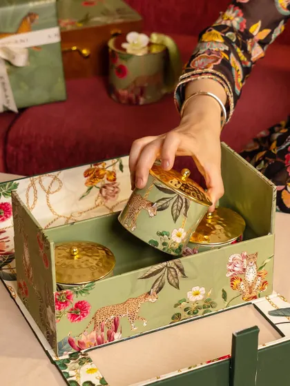 Unboxing a gift from the Tales of Tropic collection. The interior reveals themed jars, showcasing how the design story continues from the outside in, creating a complete and immersive experience.