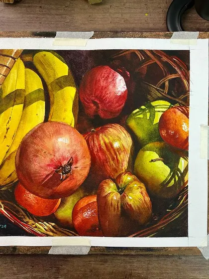 The fruit basket still life, shown on my easel next to my palette. This gives a good view of the colors used to create the vibrant, realistic fruit.
