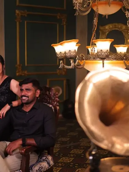A vintage themed pre-wedding shoot. The couple is dressed in black, with our simple black gown fitting the elegant, old world aesthetic.