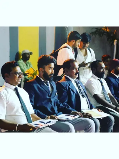 A candid shot of our instructors and officials during a championship event. We are deeply focused on ensuring a fair and well-organized competition for all participants.