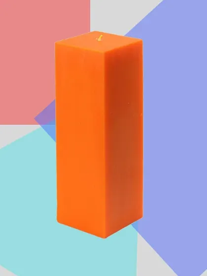 A tall, square pillar candle in a vibrant orange. This product shot highlights the smooth finish and sharp edges that define this modern candle style.