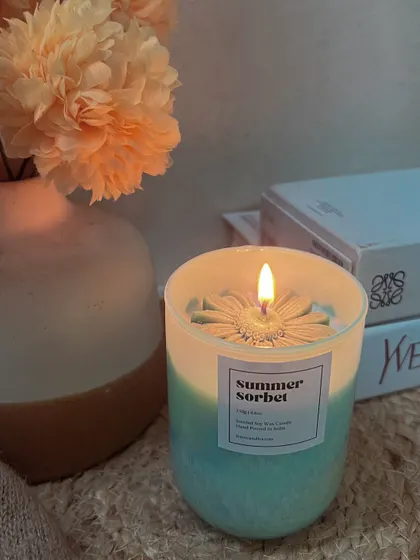 A cozy evening with our 'Summer Sorbet' candle. The warm glow and fresh scent are perfect for summer nights.