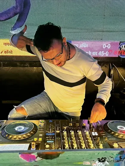 In action during a live screening of a cricket match, mixing music to keep the energy high between plays.