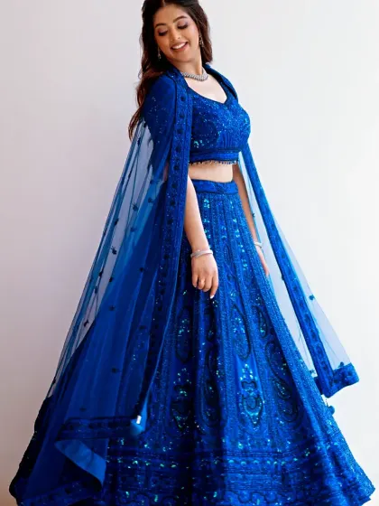 The flow and sparkle of this engagement outfit are just magical. The makeup look is kept elegant and polished, with glowing skin and a subtle shimmer on the eyes to catch the light.