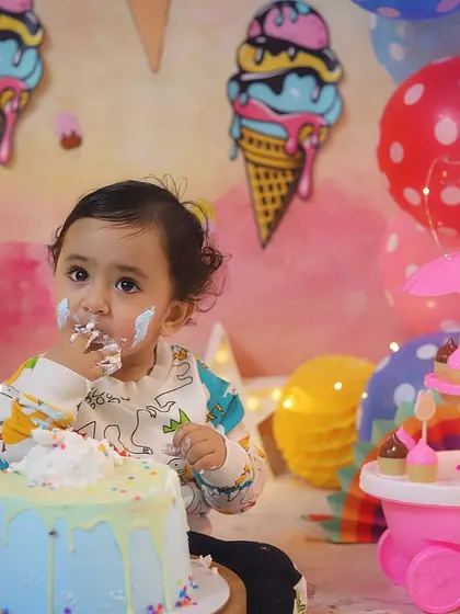A little bit of frosting on the nose just adds to the cuteness. He's loving every bite of his birthday cake.