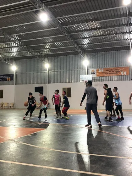 A young player learns to navigate through traffic during a practice game. Supervised scrimmages are key to applying learned skills in a real-game context.