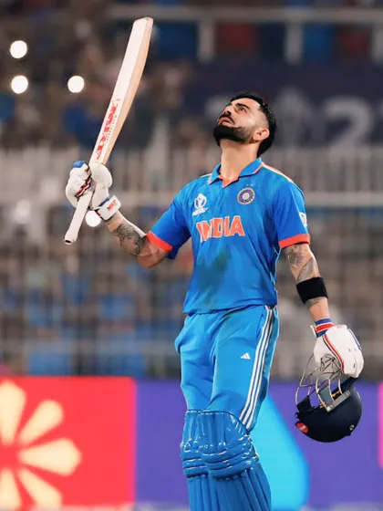 A moment of gratitude and relief from Virat Kohli, looking up at the sky after a significant achievement. This image captures the personal, emotional side of a professional athlete.