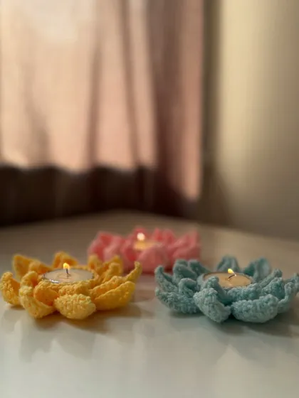 A trio of my crochet tea light holders in yellow, pink, and blue. They add a beautiful, soft ambiance to any room.