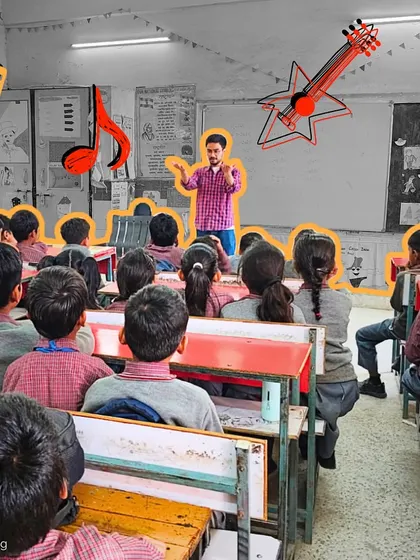 A fellow stands before his class, using music to command attention and inspire learning. Our facilitators are trained to be leaders who can manage a classroom with energy and empathy.