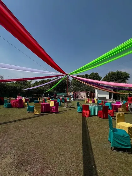 Planning a fun outdoor mehndi or Holi party? I use colorful drapes and seating to create a vibrant, festive atmosphere that looks great in photos and gets everyone in the mood to celebrate.