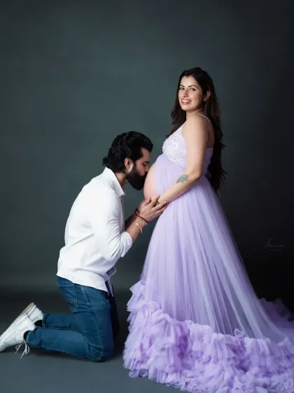 A tender moment between the dad-to-be and his unborn baby. This pose is a client favorite, capturing the love and anticipation in a beautiful way.