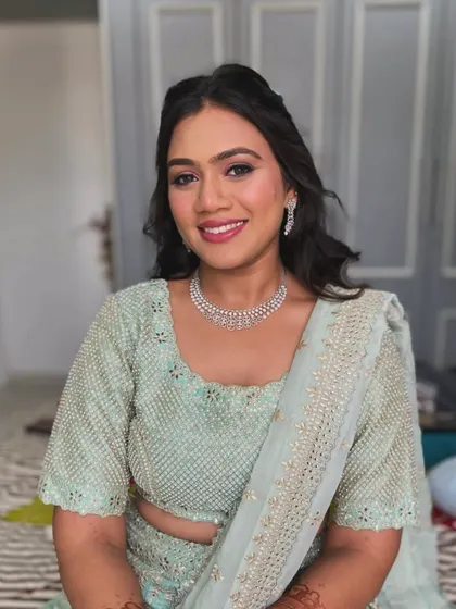 A portrait showing the "Noor" or glow on her face. The soft glam makeup enhances her natural beauty, making her shine.