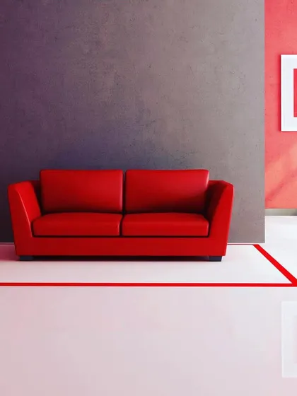 A minimalist room design using a combination of red and dark grey accent walls. The precise red line on the floor is also a painted element, showing my attention to detail.