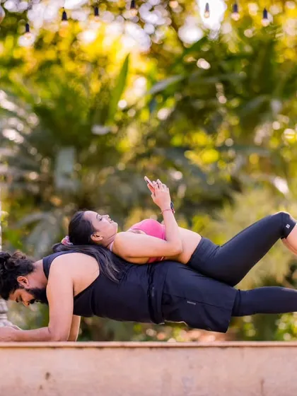 A creative and fun pose during a fitness-themed shoot. This shows that your pre-wedding photos can truly reflect your shared hobbies and passions.