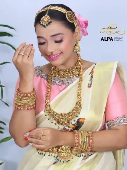 The bride admiring her bangles, a shot that highlights the intricate jewelry.