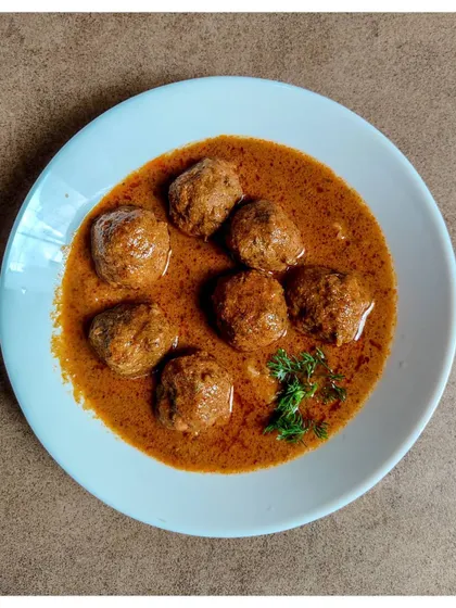A bowl of my Khaima Unde Saaru, or lamb meatball curry. This family heirloom recipe features a rich gravy packed with flavours from the meatballs and homemade masala.