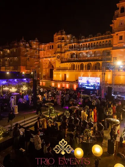 A Sangeet night at Manek Chowk, with the City Palace, Udaipur, serving as a magnificent, living backdrop. I leverage the inherent grandeur of such venues to create an unparalleled experience.