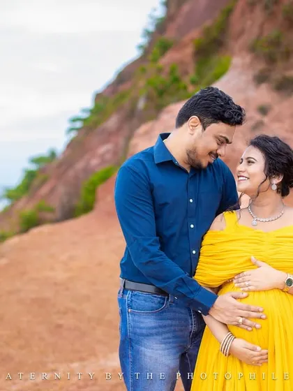 A loving gaze between the couple, captured on the scenic cliffs of Varkala.